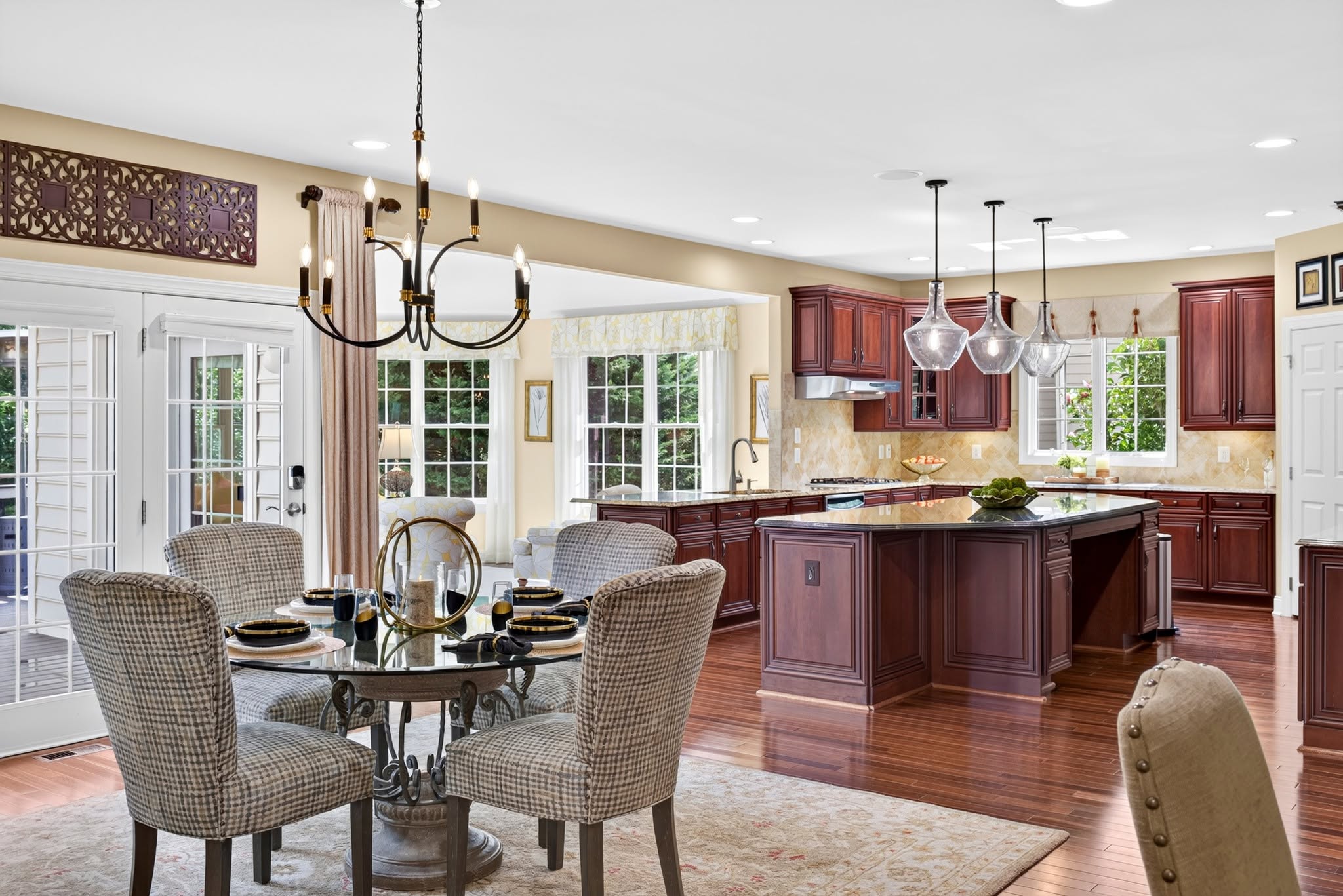 Kitchen with a cherry island open to a dining area